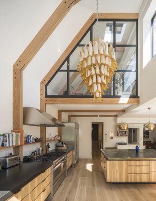 kitchen with double height vaulted ceiling and internal window