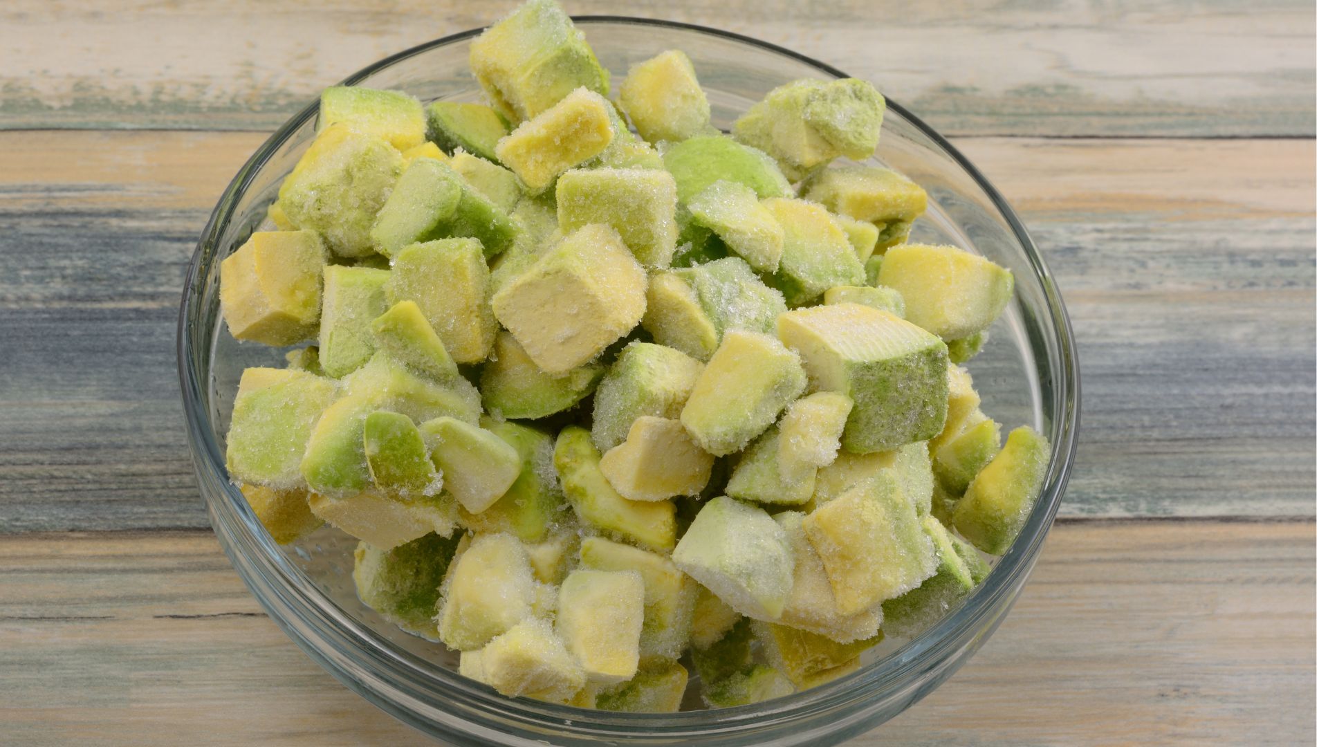 Chopped up avocado in a glass dish