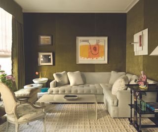 Green living room with cream sectional