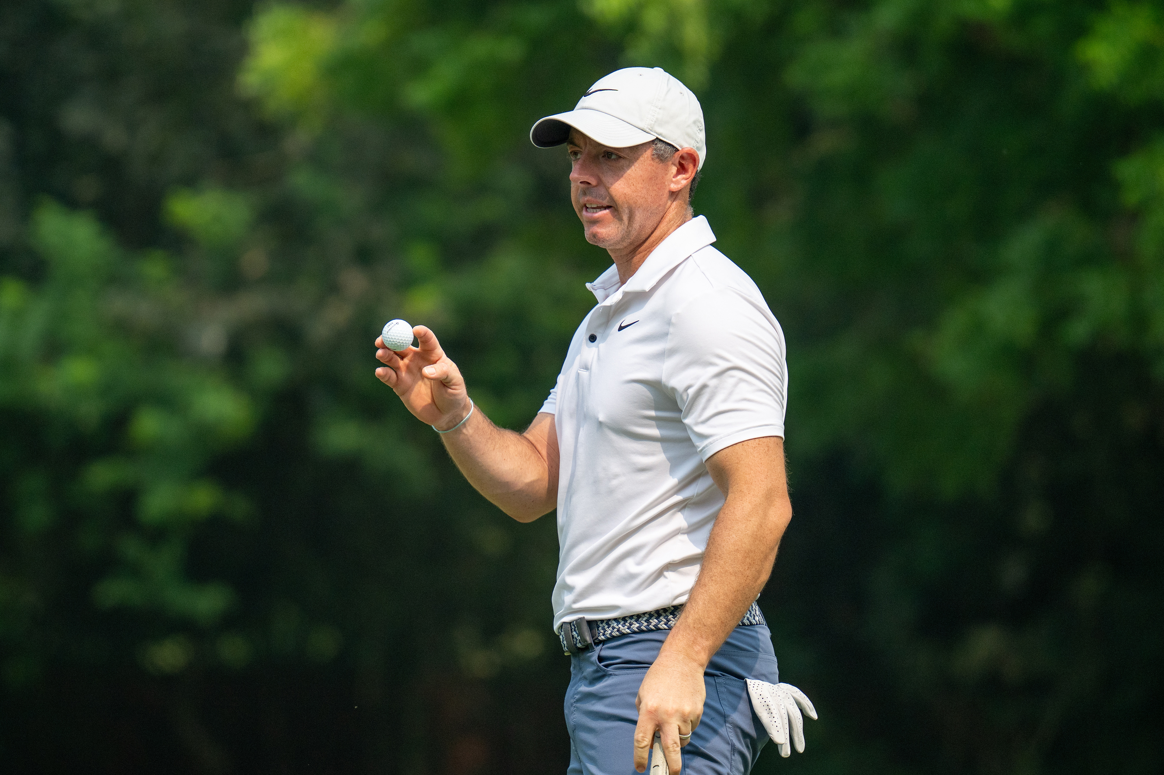 Rory McIlroy waves to fans
