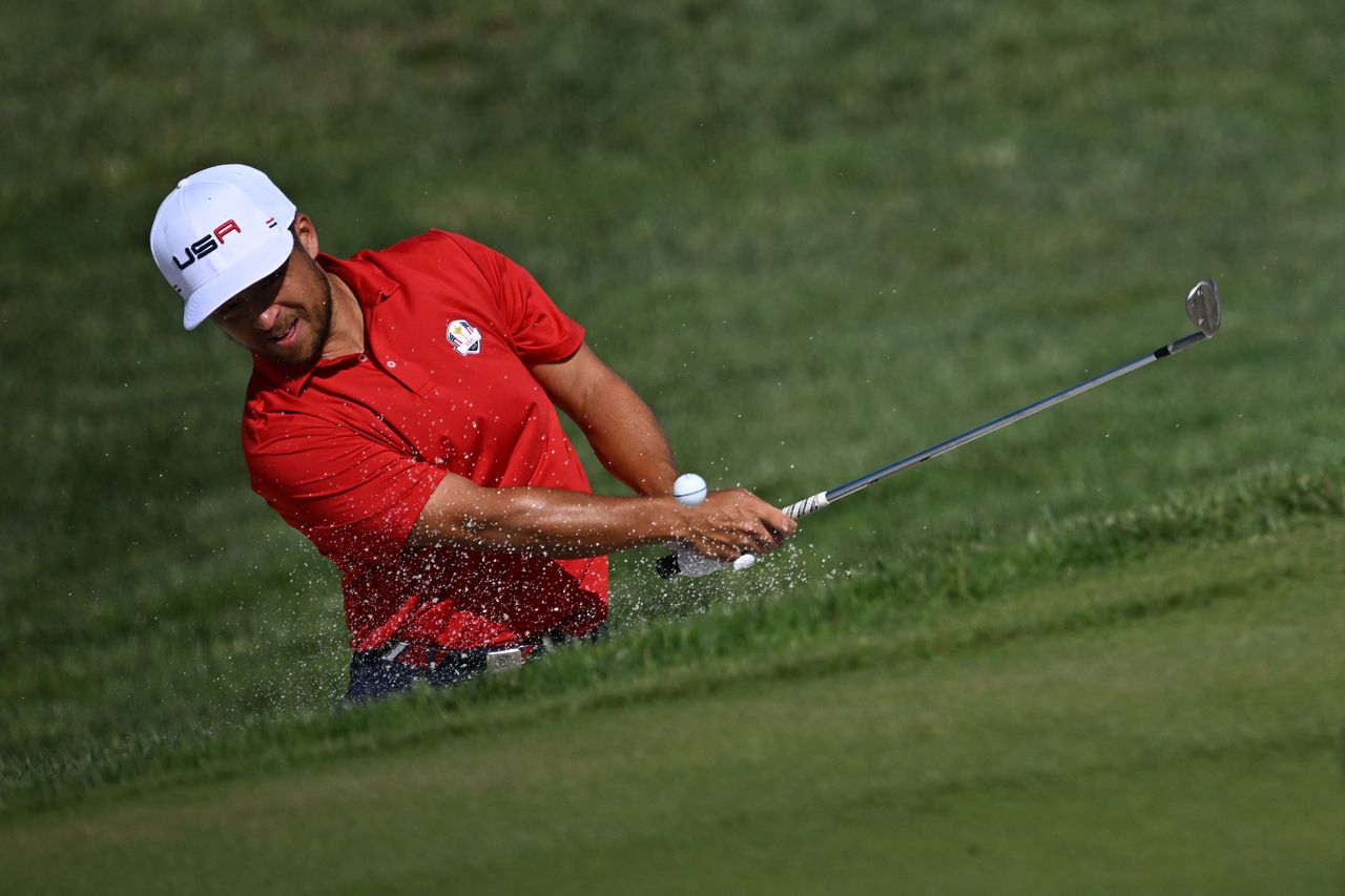 Xander Schauffele hitting a bunker shot