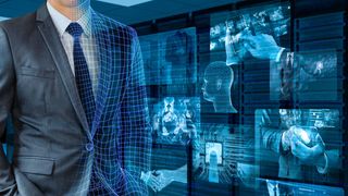 Person in suit next to computer monitors - digital transformation benefits business