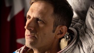 an astronaut in a white spacesuit