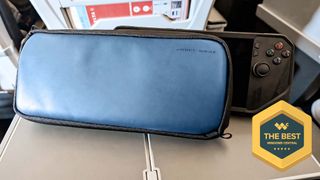 Waterfield ROG Ally Magnetic Case in front of an ROG Ally X on an airplane tray. A badge on the screen reads, "The Best Windows Central."