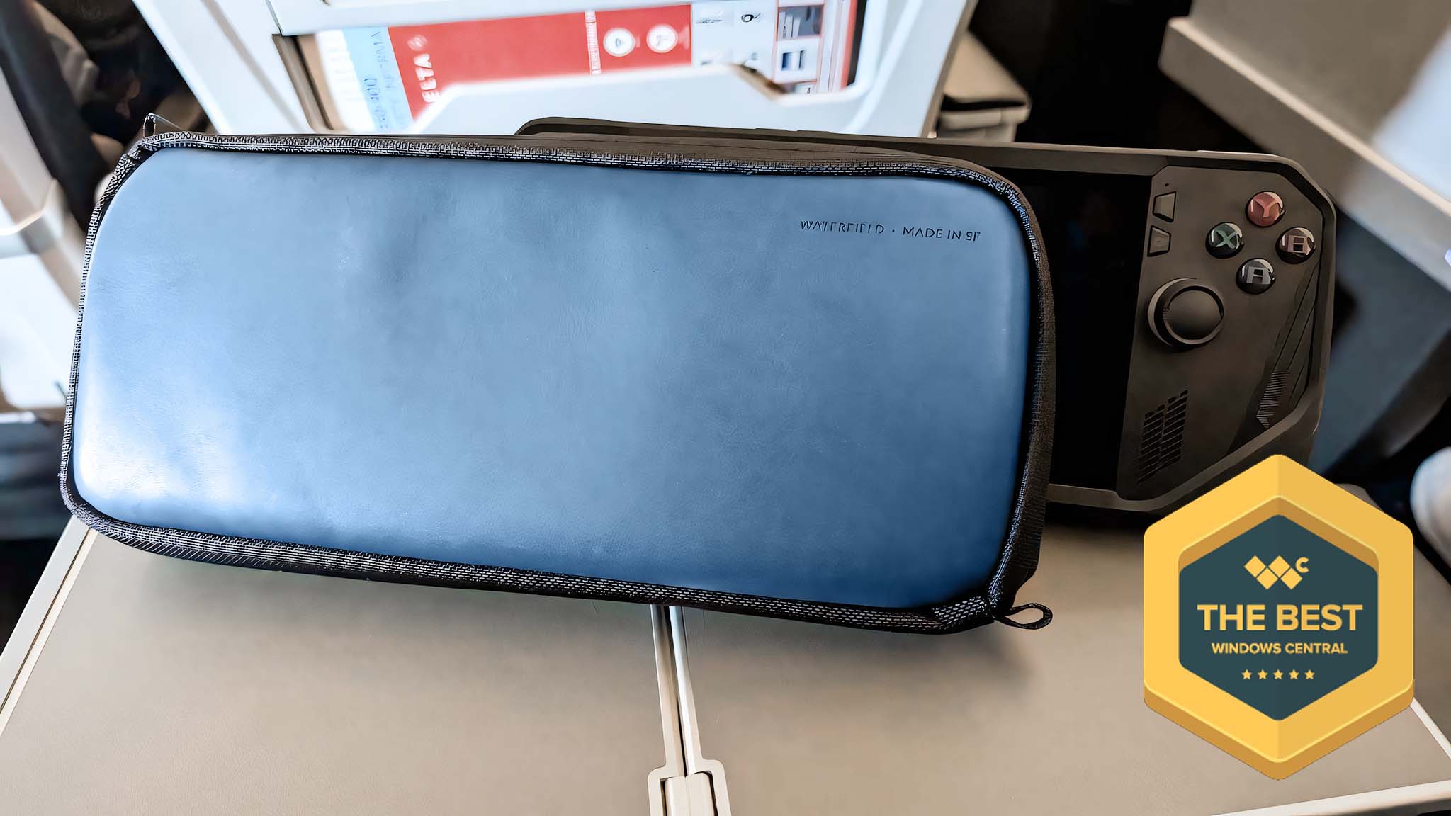 Waterfield ROG Ally Magnetic Case in front of an ROG Ally X on an airplane tray. A badge on the screen reads, &quot;The Best Windows Central.&quot;