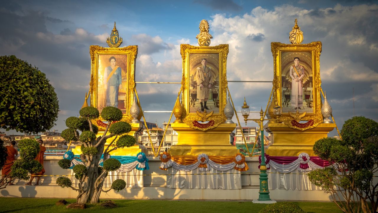 Portraits of the Thai royal family at the Wat Arun temple in Bangkok. 