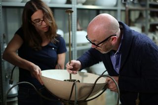 Jolene Farmer and Drew Pritchard working on an Italian spider chandelier