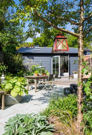 Garden designer Nic Howard used his creative skills to turn a compact courtyard into a haven bursting with colour and interest