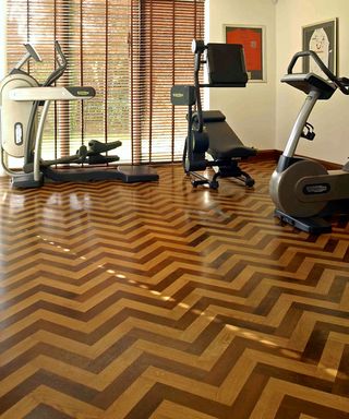 An engineered parquet wood floor in a home gym