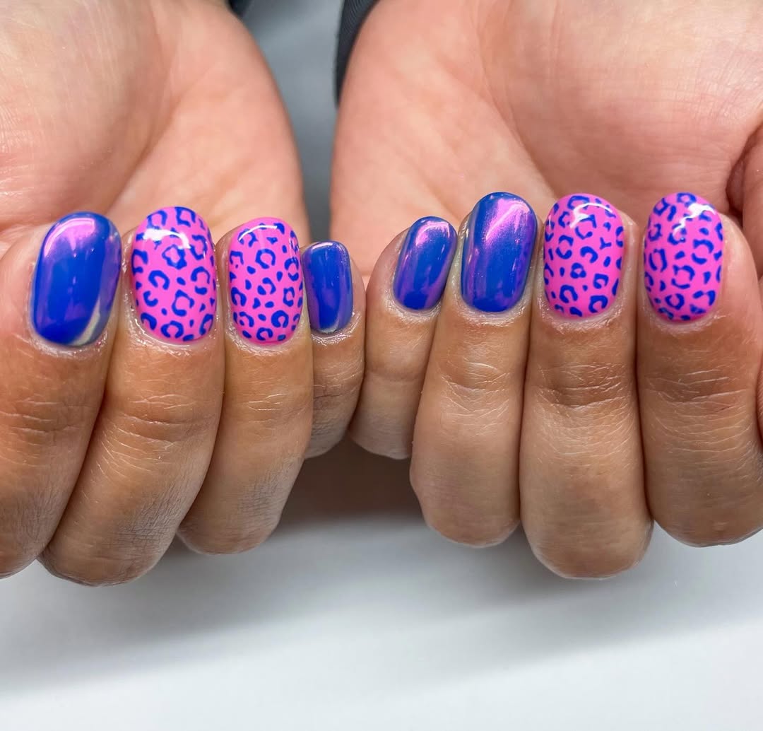 pink leopard nails with chrome purple accent nails