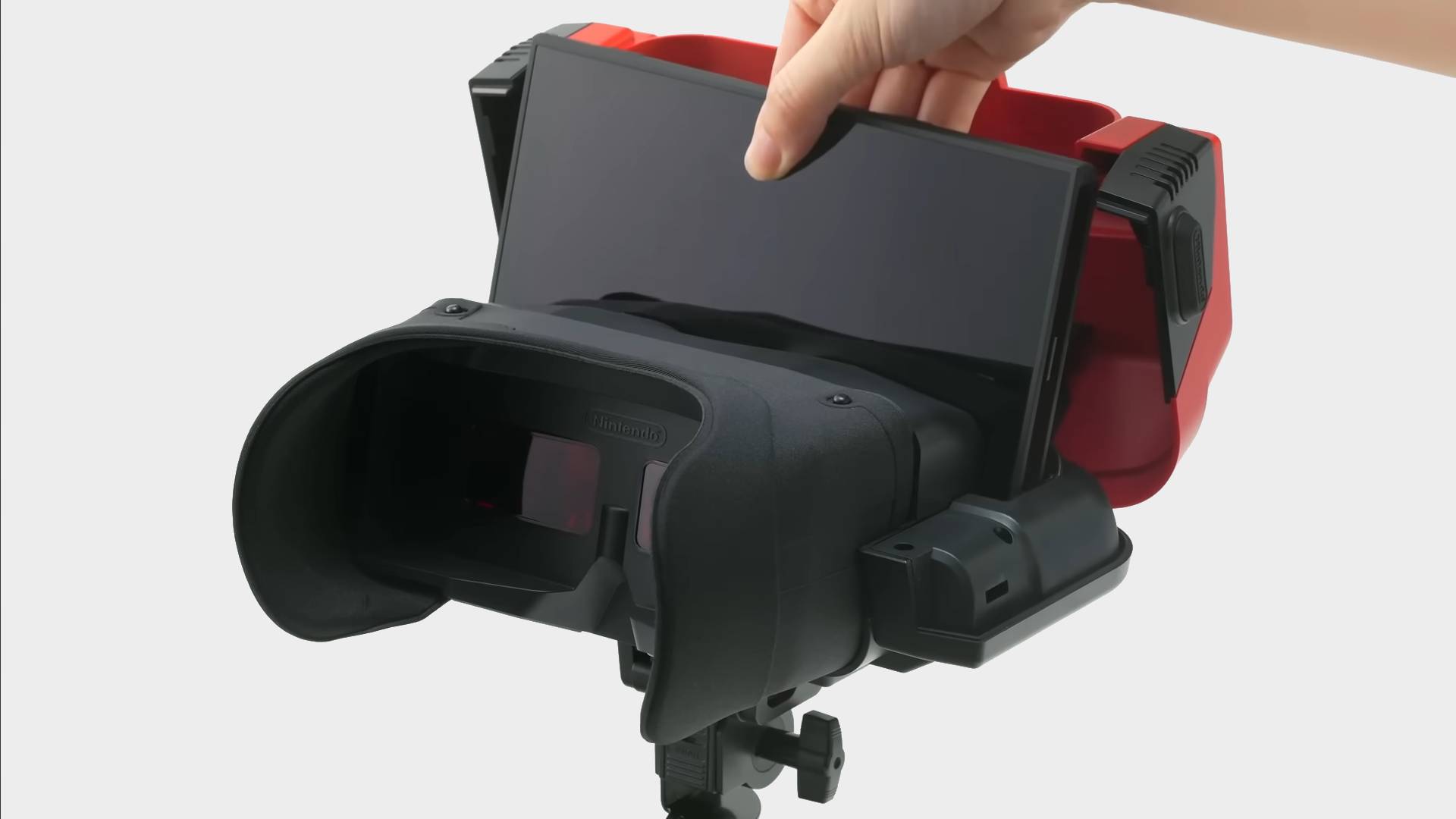 Hand inserting Switch 2 into Virtual Boy.