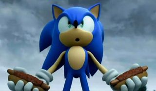 Sonic holding chili dogs