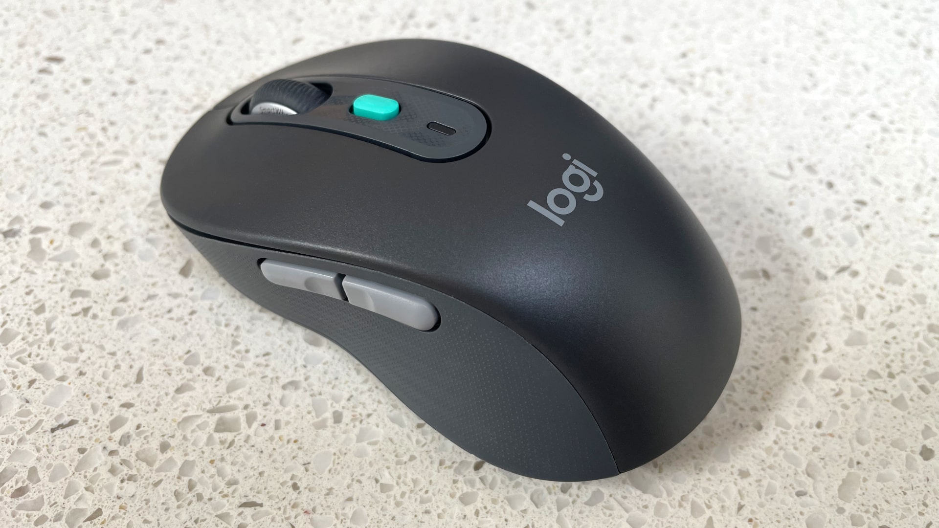 The Logitech Signature AI Edition M750 mouse on a worktop.