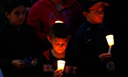 Young children attend a vigil for 8-year-old Martin Richard, from Dorchester, who was killed by explosions at the Boston Marathon.