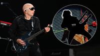 Joe Satriani playing guitar on stage