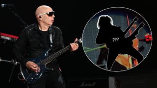 Joe Satriani playing guitar on stage