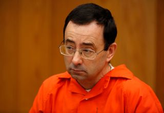 Former Michigan State University and USA Gymnastics doctor Larry Nassar listens during the sentencing phase in Eaton, County Circuit Court