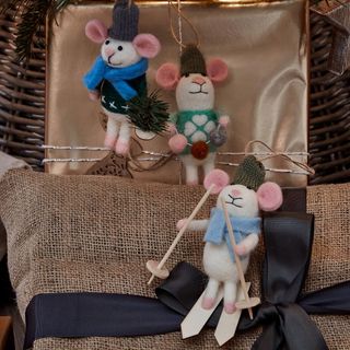 christmas decor mice with golden cushion and black ribbon