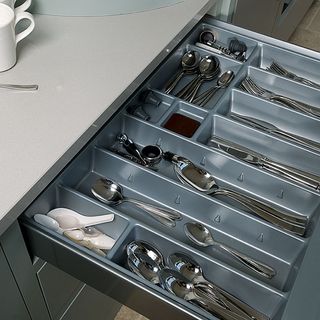 kitchen room with utensil drawer and spoon