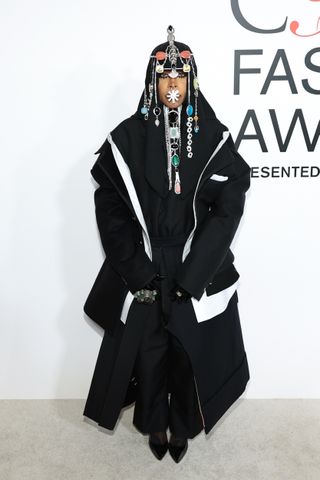 Erykah Badu in an oversized look and headpiece at the 2024 cfda awards