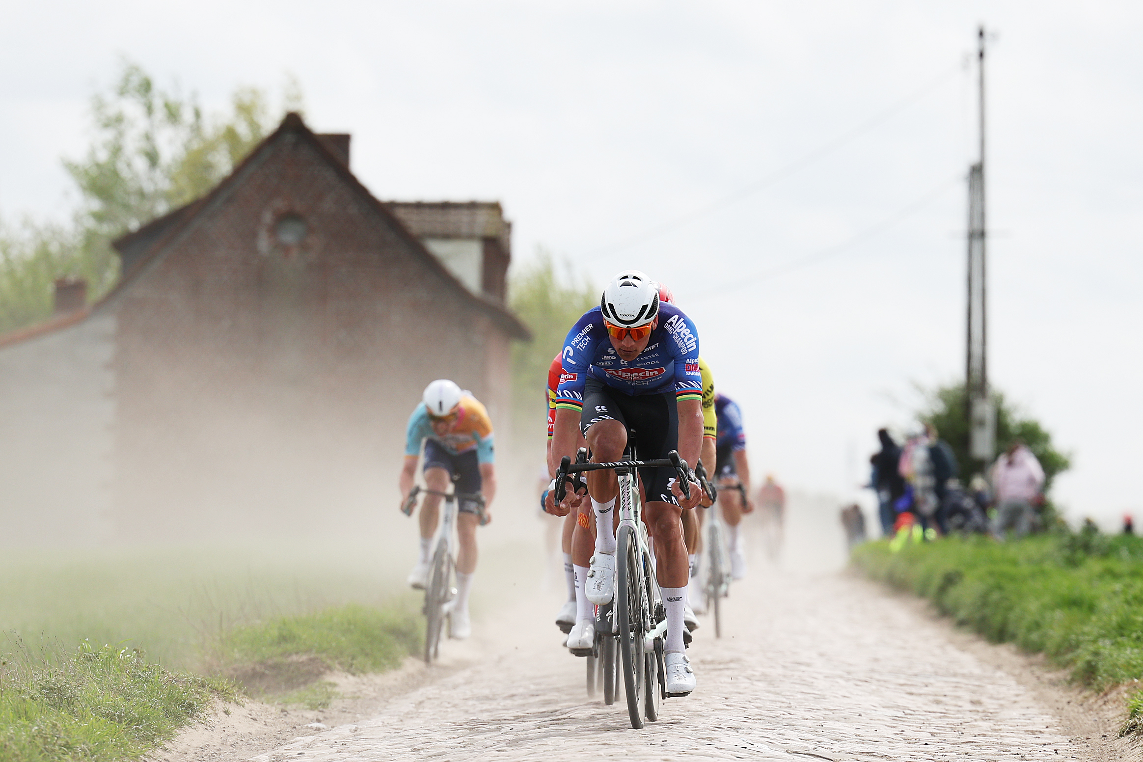Mathieu van der poel at Paris Roubaix racing over the cobblestones