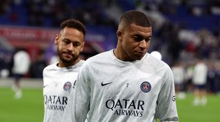 Neymar and Kylian Mbappe warm up for PSG's match against Lyon.