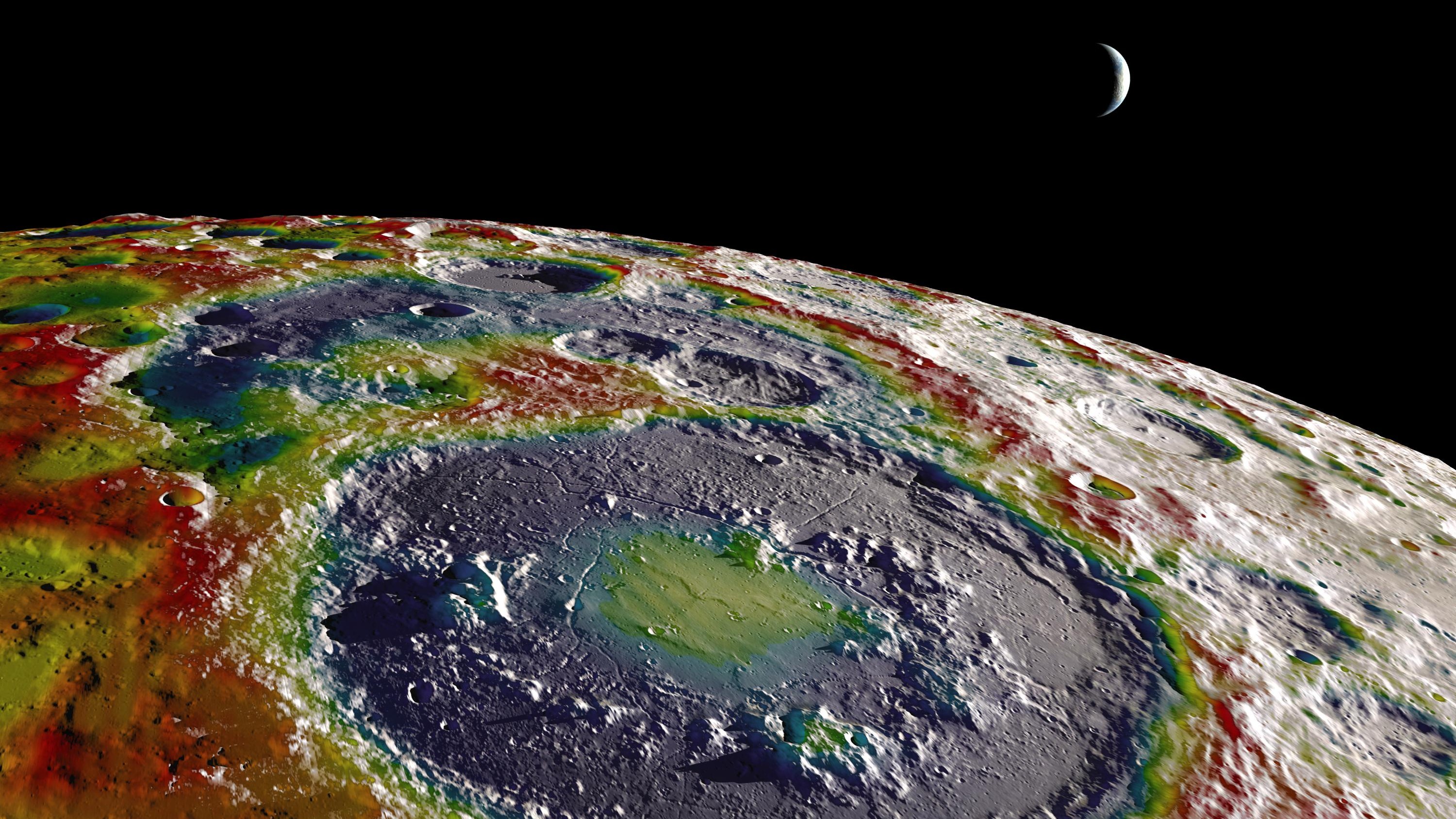 A false color image of the lunar south pole, showing areas of lower gravity in purple and higher gravity in red