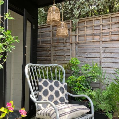 hanging lights with chair outside summerhouse