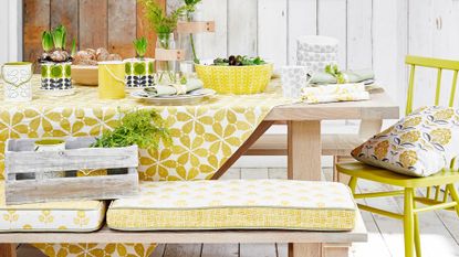 tablecloth on gen z yellow with bench and chair