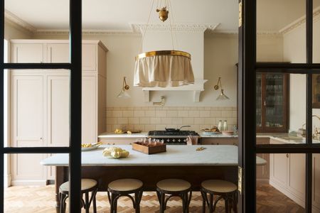 putty beige kitchen with fabric light and subway tiles by deVOL