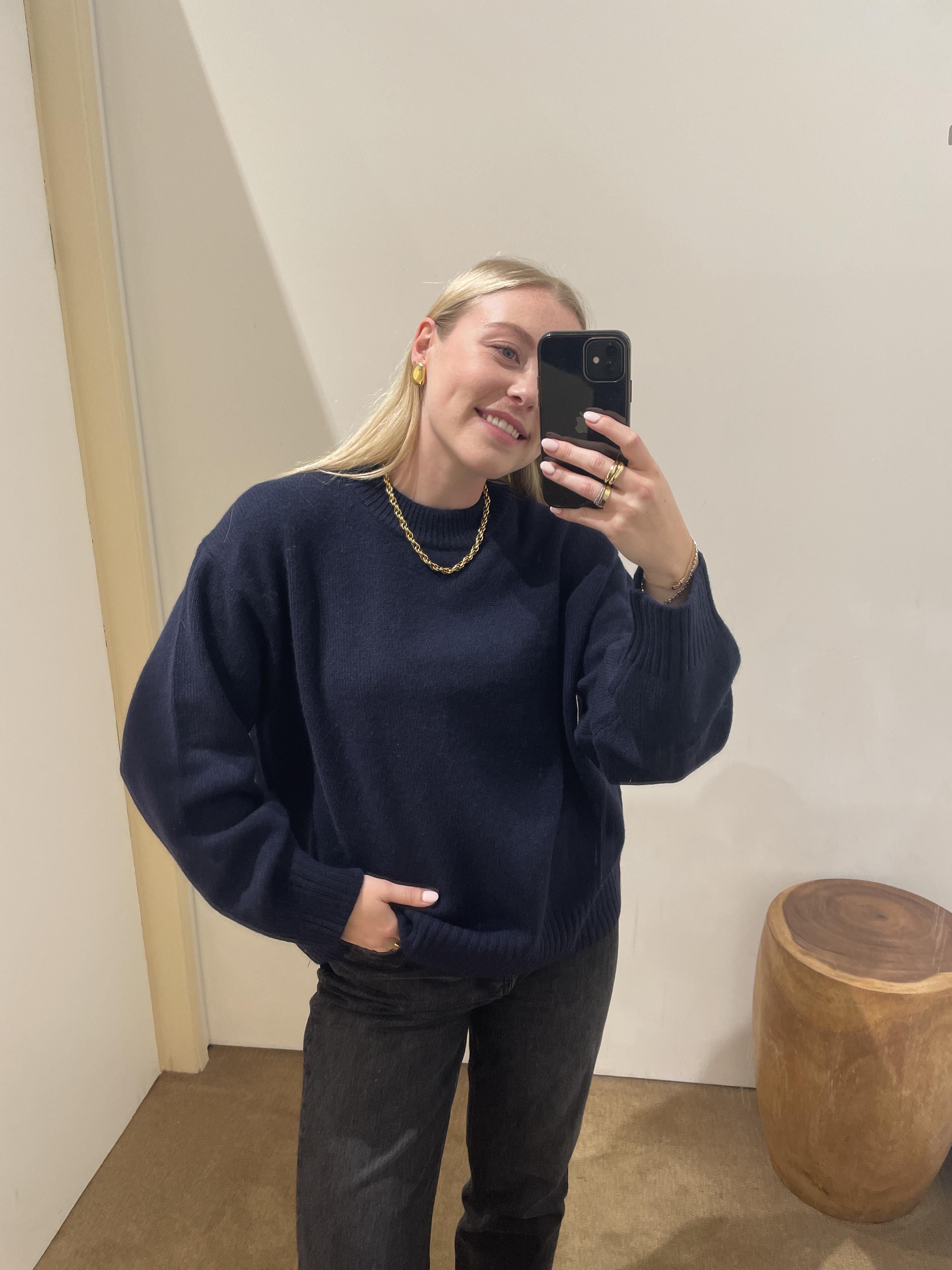 Florrie wearing the Reformation Cove Jumper in Navy