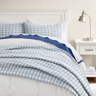 Pebble Beach Coverlet on a bed.