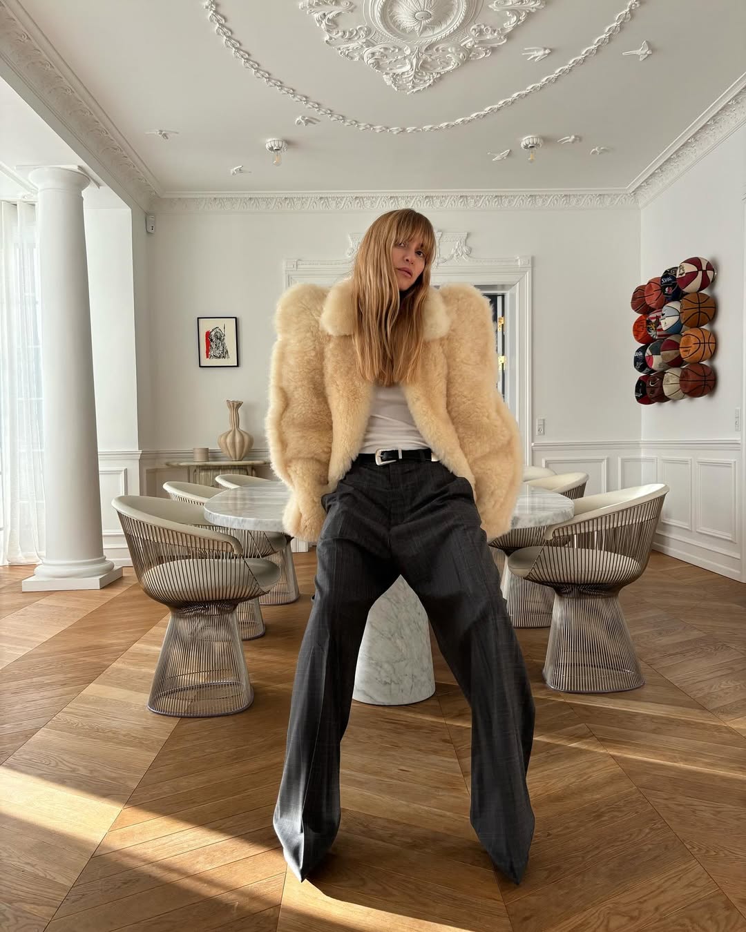 pernille teisbaek wears a fur jacket, tailored trousers and tank top