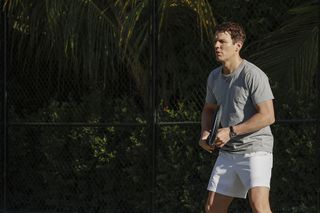 Troy playing tennis.