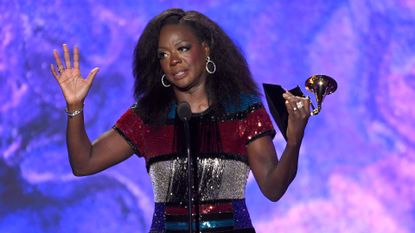 Viola Davis holding a Grammy on stage