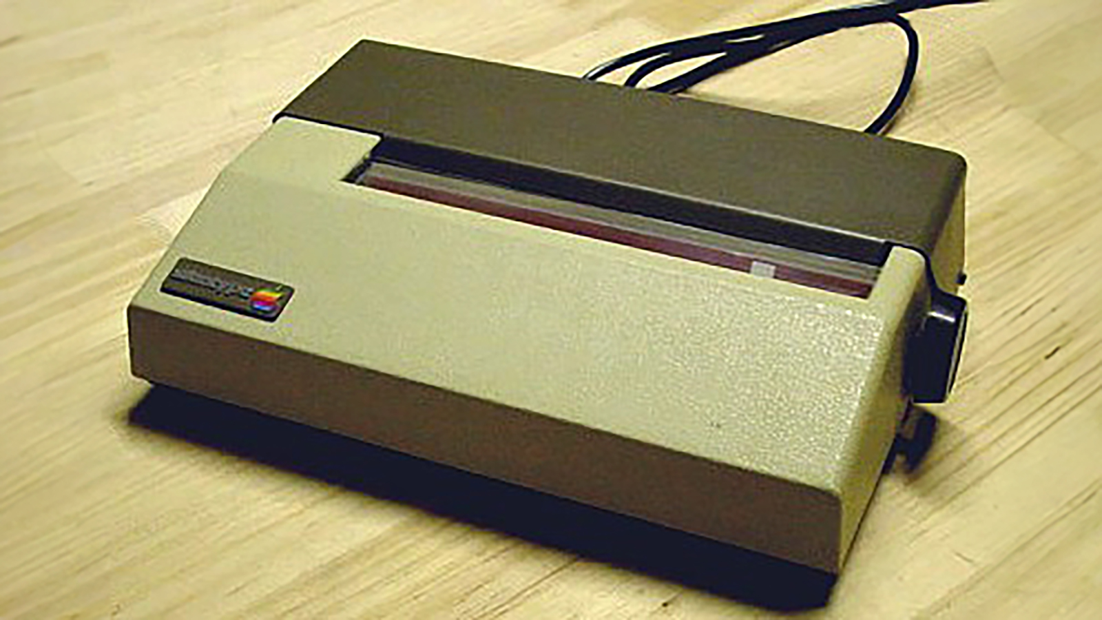 An Apple Silentype sitting on a wooden table