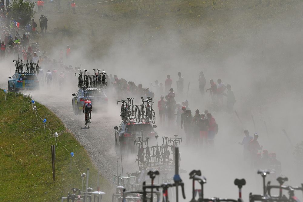 Fans along the route get showered in dust during stage 10 at the tour de France