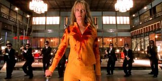 Kill Bill Vol. 1 The Bride with her back turned to some of the Crazy 88s
