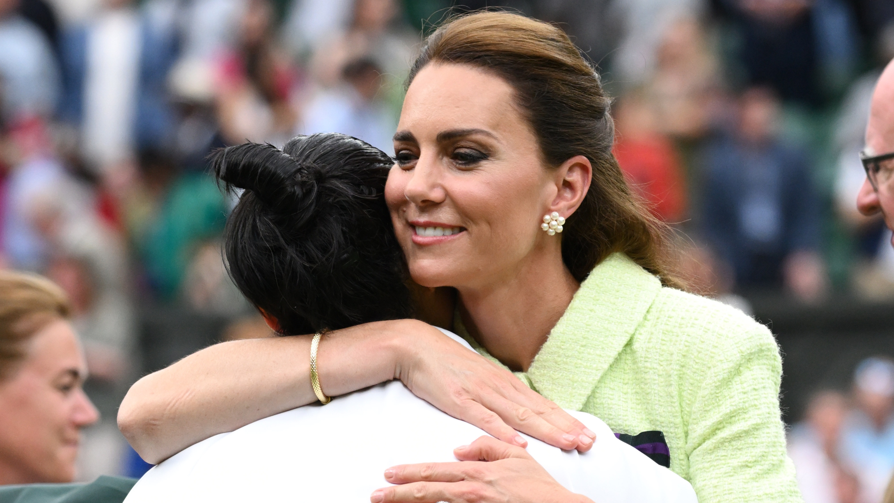 Catherine, Princess of Wales hugs Ons Jabeur on day thirteen of the Wimbledon Tennis Championships at All England Lawn Tennis and Croquet Club on July 15, 2023