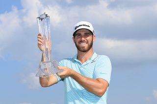 Matthew Wolff holds the 3M Open trophy in 2019