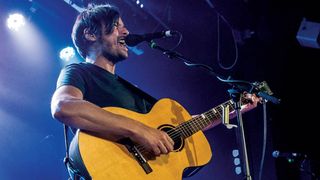 The Pineapple Thief frontman Bruce Soord playing guitar on stage