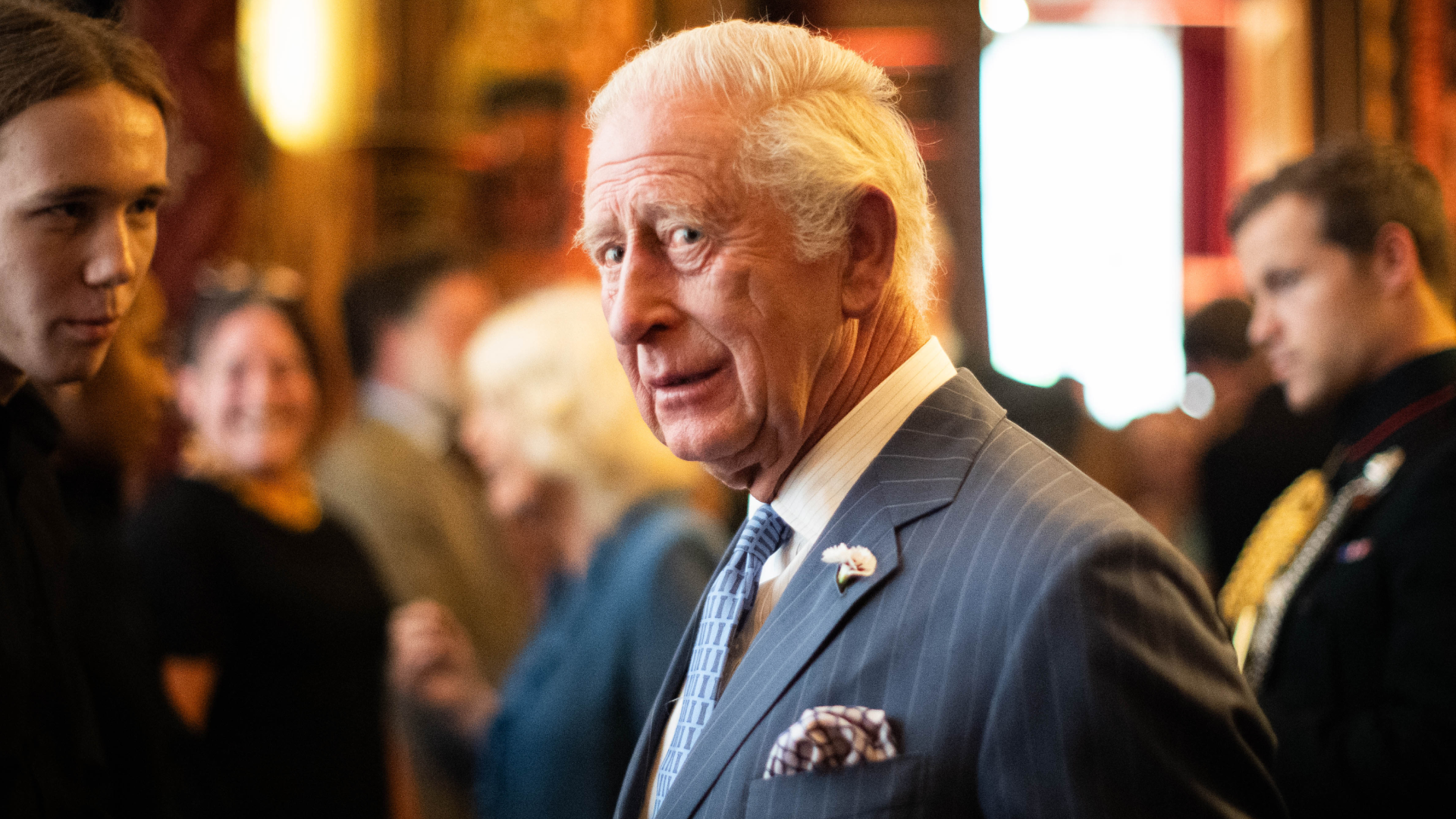 King Charles wearing a blue striped suit