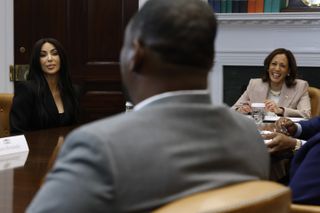 Kim Kardashian (C) joins Vice President Kamala Harris and Jason Hernandez during a roundtable discussion on criminal justice reform in the Roosevelt Room at the White House on April 25, 2024 in Washington, DC.
