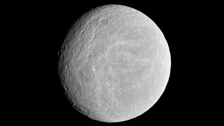 a light grey moon with some craters against a black background.