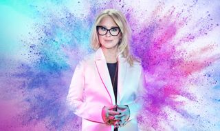 Glow Up: Britain's Next Make Up Star — a stylised picture of judge Val Garland standing in front of a multicoloured explosion of powder