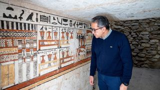 A wall painting found in one of the tombs is seen here. Hieroglyphic writing can be seen at the top of the painting. 
