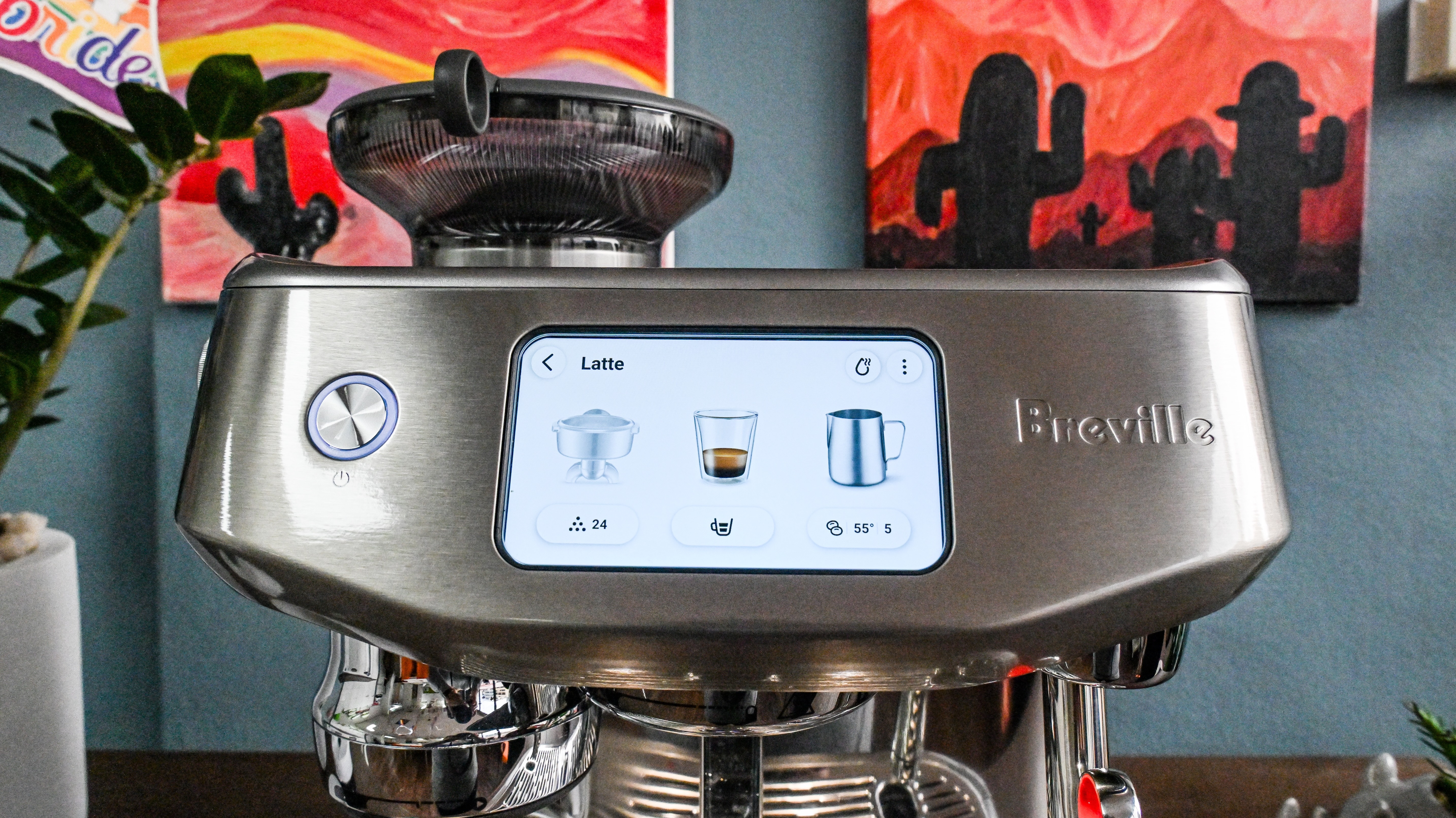 A close up of the Breville Oracle Jet coffee machine's LCD display, showing controls for grinding, shot volume and milk type and temperature.