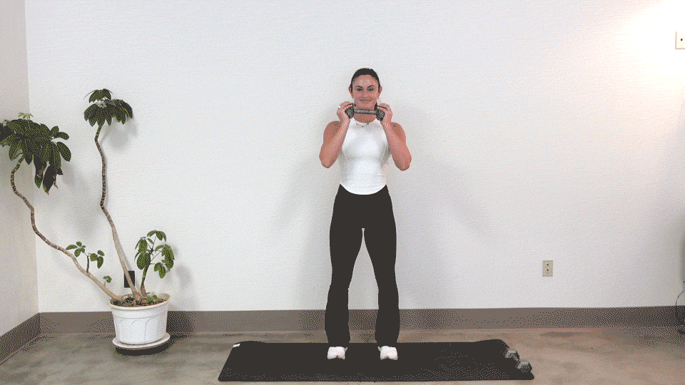 Trainer Kirra Mitlo doing dumbbell marches