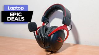 HyperX Cloud II wireless gaming headset on a wooden desk with white background