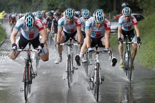 Omega Pharma-Lotto riders keep their feet dry in trying conditions.